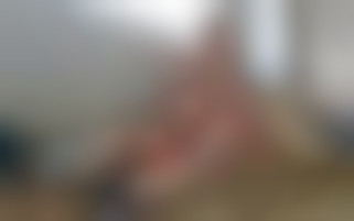 In a barn while friends watches